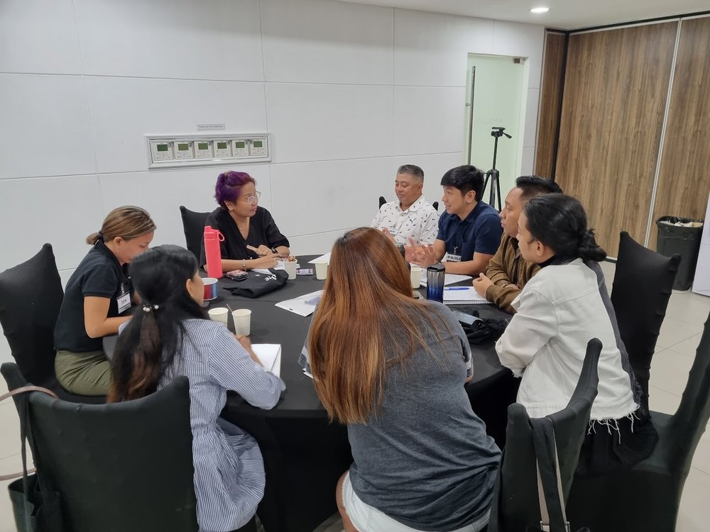 Coach Gina Katigbak coaches a small group during the Leadership Coaching MasterClass intensive.